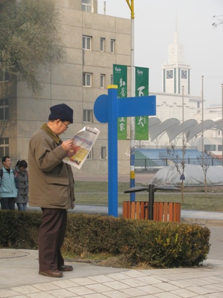 Man reading newspaper