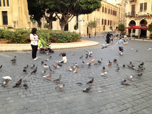 Children playing near pigeons in Beirut's Place de l’Étoile