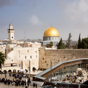 The skyline of Jerusalem's Old City, with the Wailing Wall in the foreground and the Dome of the Rock in the background