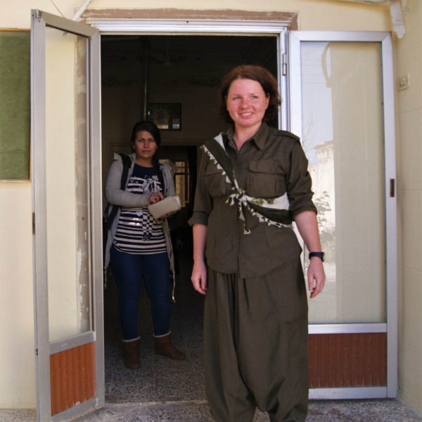 Dr. Rohani stands in the doorway of her clinic
