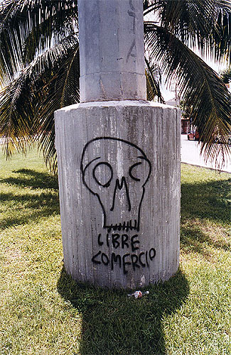 Column base with skull and words spray-painted on it