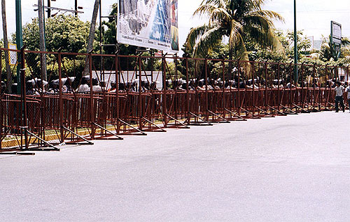 Police officers standing behind the barricades