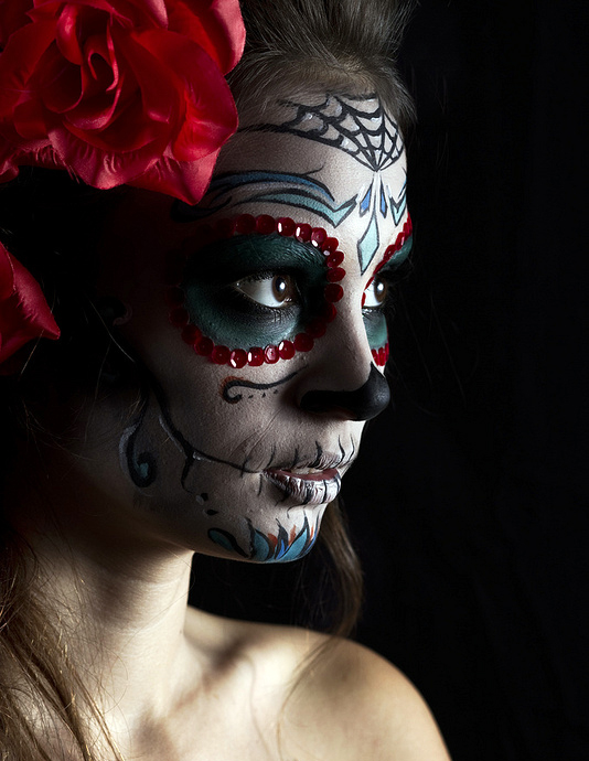 photo of a young woman with Mexican face paint.