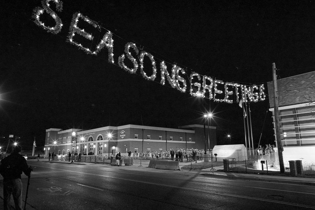 Ferguson protest underneath Seasons Greetings lights