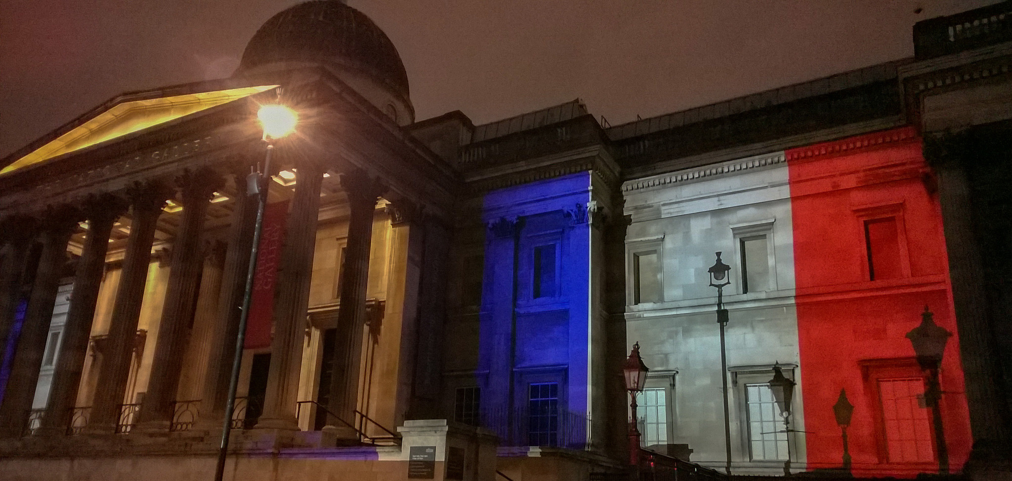 Building lit with French flag
