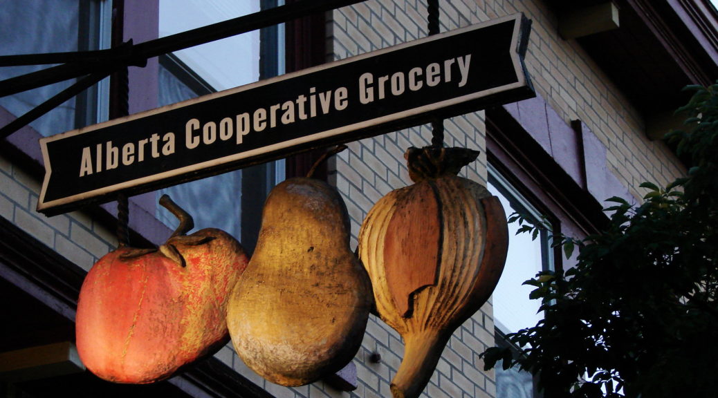 Alberta Cooperative Grocery sign with carved fruit